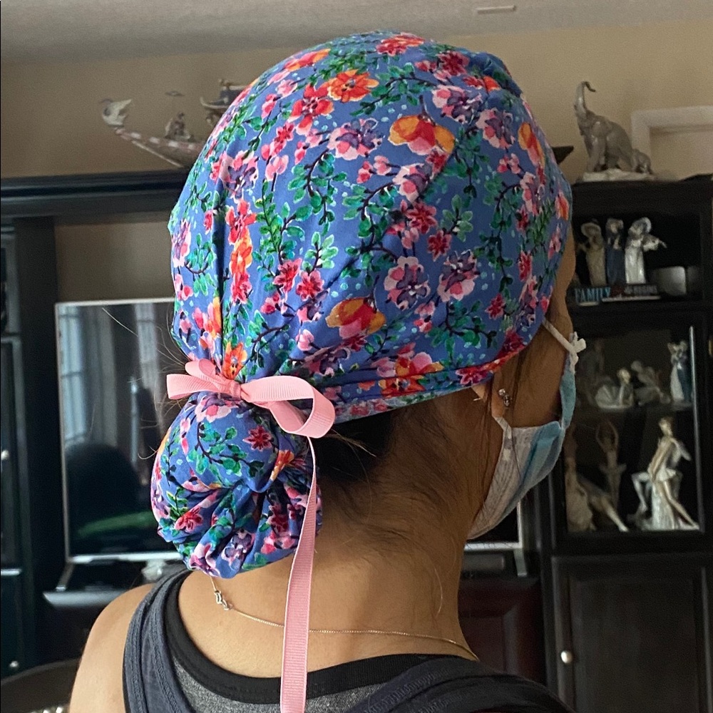 Surgical cap with pony/bun pouch.